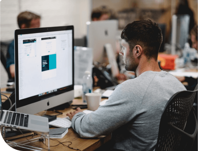 Image of a person working on a computer
